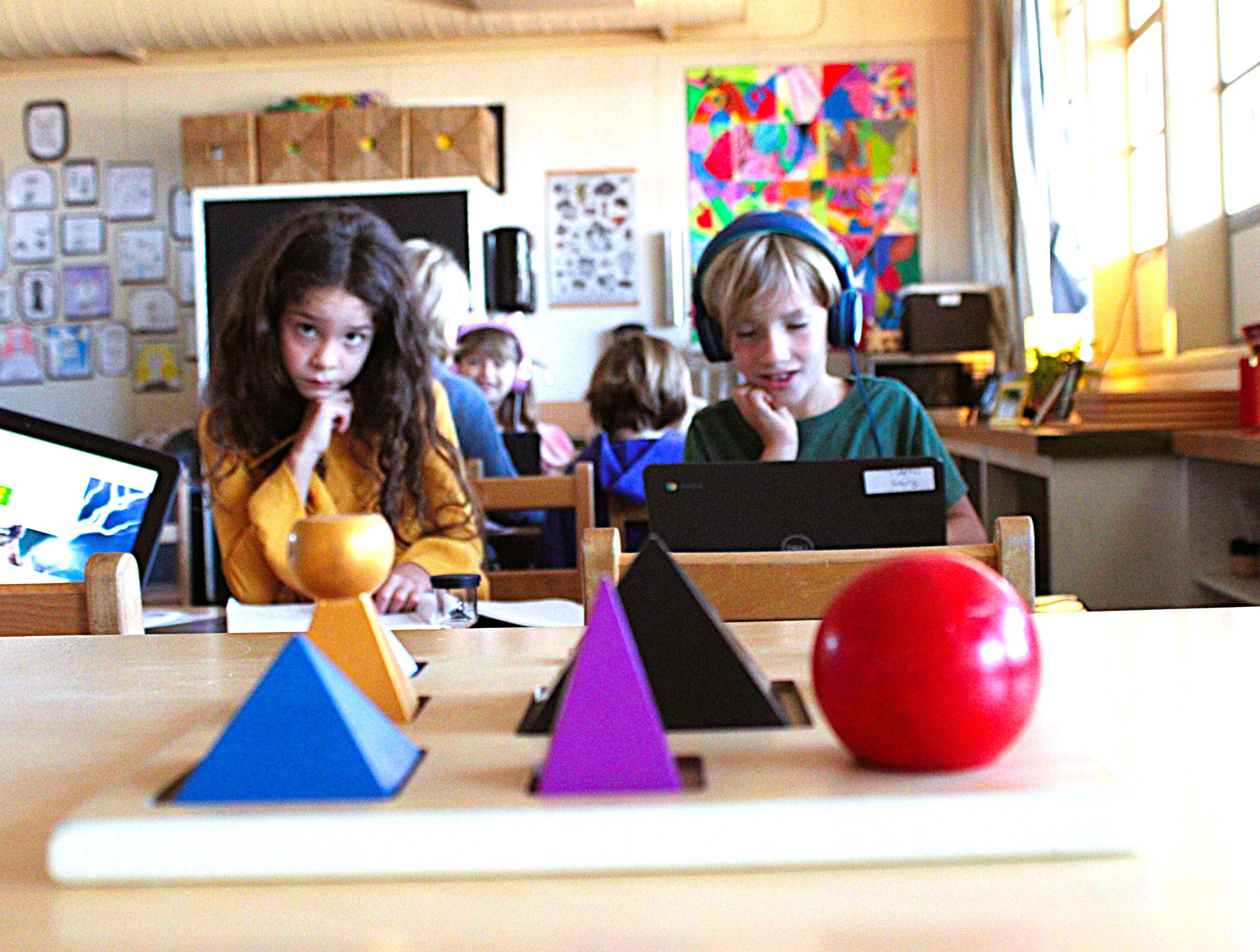 Montessori materials - shapes and two students